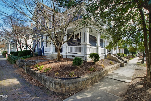 view of property exterior featuring a porch