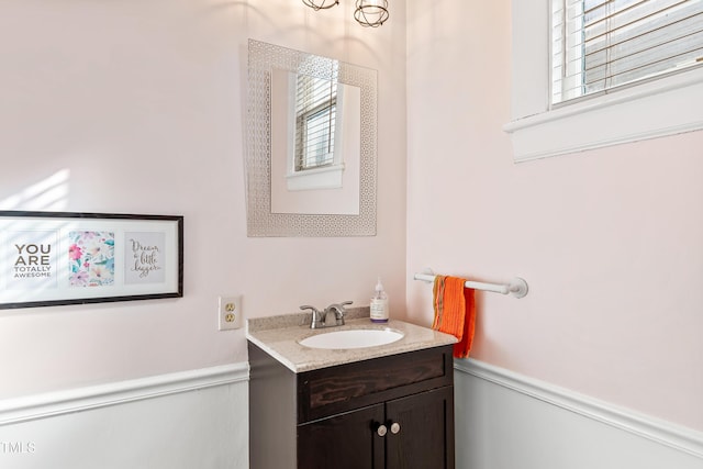 bathroom featuring a healthy amount of sunlight and vanity