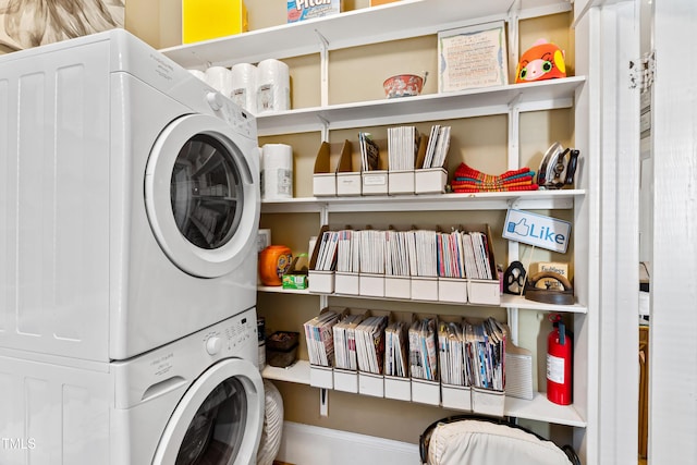 laundry area with stacked washer and clothes dryer