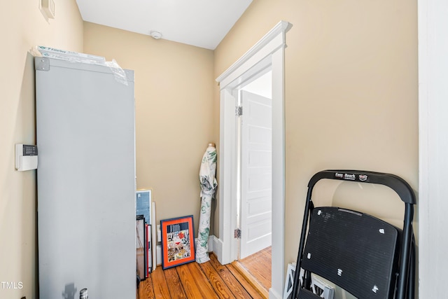 workout room with light hardwood / wood-style flooring