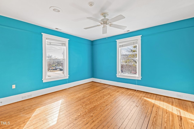 unfurnished room with light hardwood / wood-style floors and ceiling fan