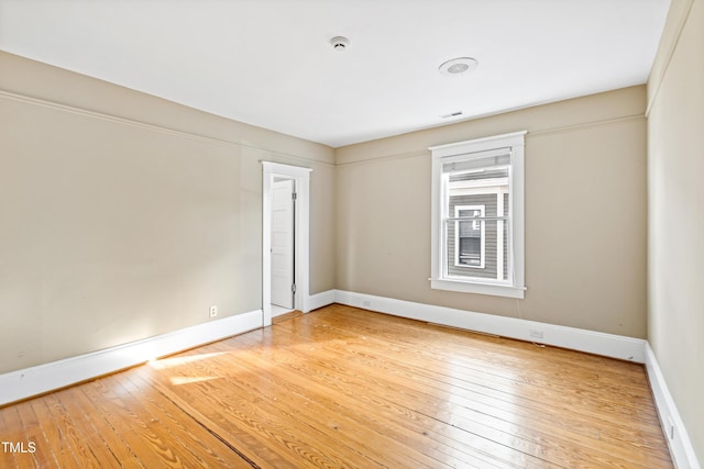 unfurnished room featuring hardwood / wood-style floors