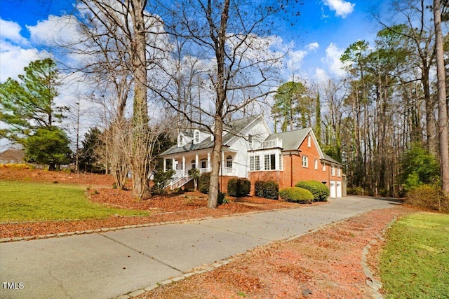 view of front of house with a garage and a front yard