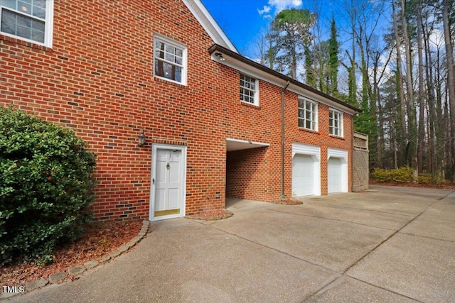 view of side of property with a garage