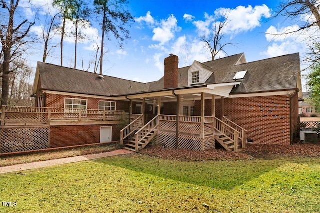 rear view of property with a wooden deck, a yard, and cooling unit