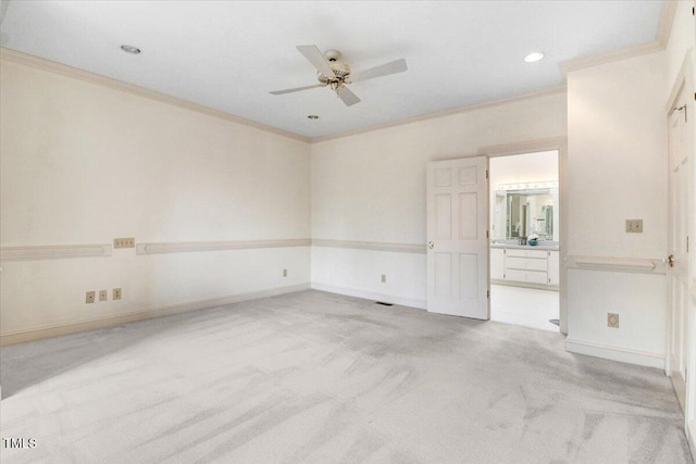 carpeted empty room with crown molding and ceiling fan