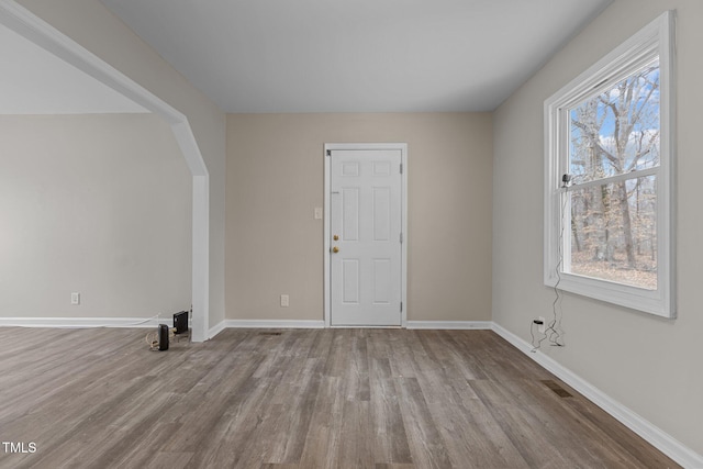 spare room with light hardwood / wood-style floors