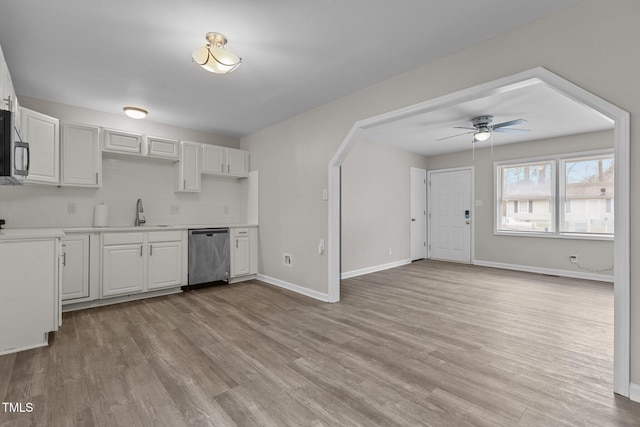 kitchen featuring light hardwood / wood-style floors, white cabinets, and appliances with stainless steel finishes