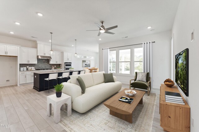 632 Gainer Dr # 19, Raleigh, NC 27610 - living room with a ceiling fan, light wood-type flooring, recessed lighting, and baseboards
