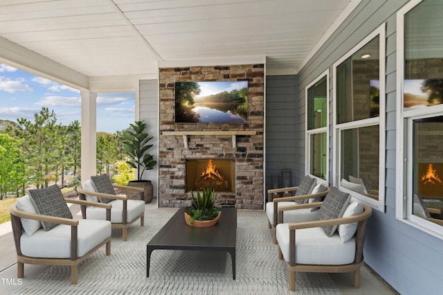 632 Gainer Dr # 19, Raleigh, NC 27610 - view of patio / terrace with a warm lit fireplace