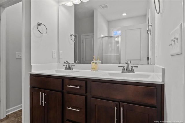 bathroom featuring vanity and walk in shower