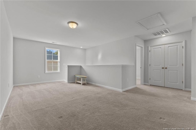 spare room with light colored carpet