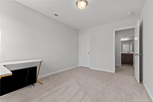 unfurnished bedroom with light colored carpet