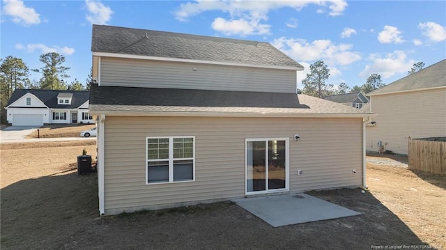 rear view of house featuring central air condition unit and a patio area