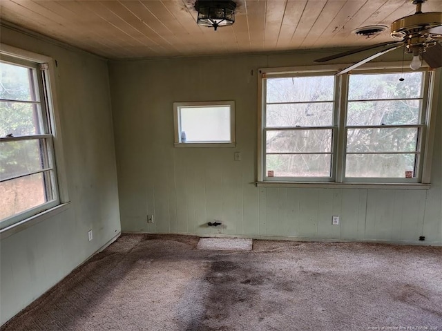 unfurnished room with ceiling fan, carpet floors, and wooden ceiling