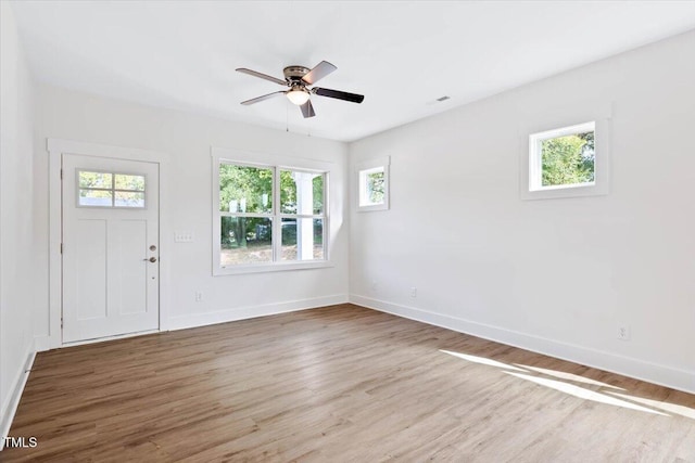 entrance foyer with ceiling fan and light wood-type flooring