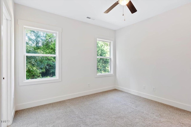 empty room featuring ceiling fan and carpet flooring