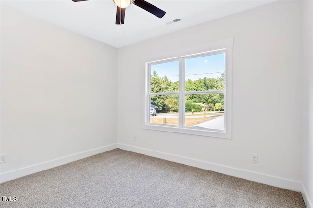 carpeted empty room with ceiling fan