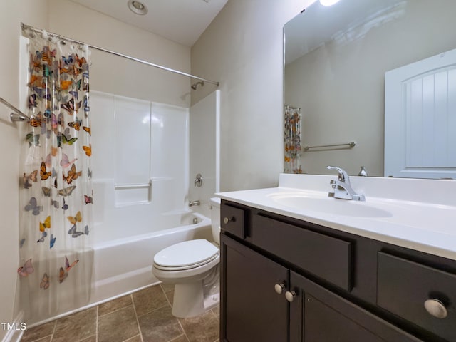 full bathroom with vanity, shower / tub combo, and toilet