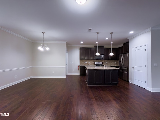 kitchen featuring pendant lighting, a kitchen island with sink, stainless steel appliances, and dark hardwood / wood-style floors