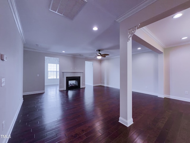 unfurnished living room with dark hardwood / wood-style flooring, ornamental molding, and ceiling fan