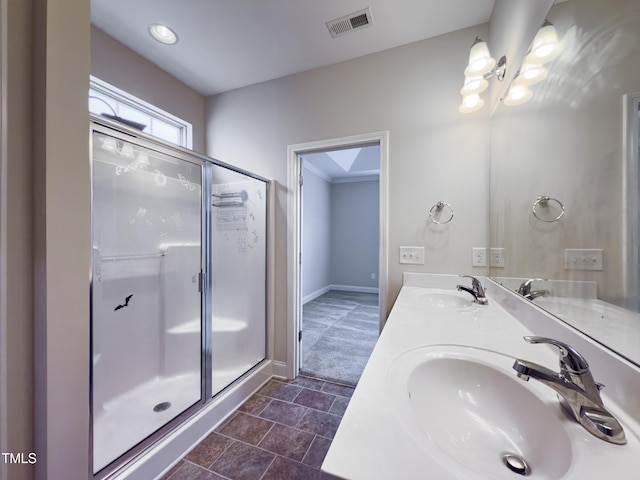 bathroom featuring an enclosed shower and vanity