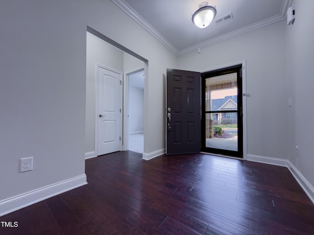 foyer with dark hardwood / wood-style flooring and crown molding