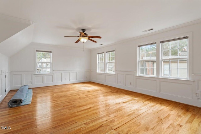 bonus room featuring light wood finished floors, visible vents, and a ceiling fan