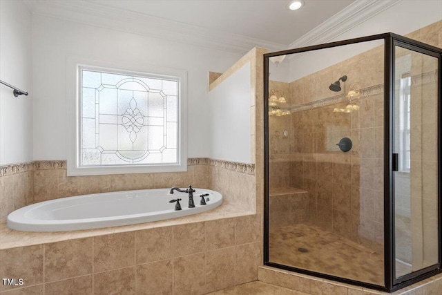 full bathroom featuring ornamental molding, a stall shower, and a garden tub