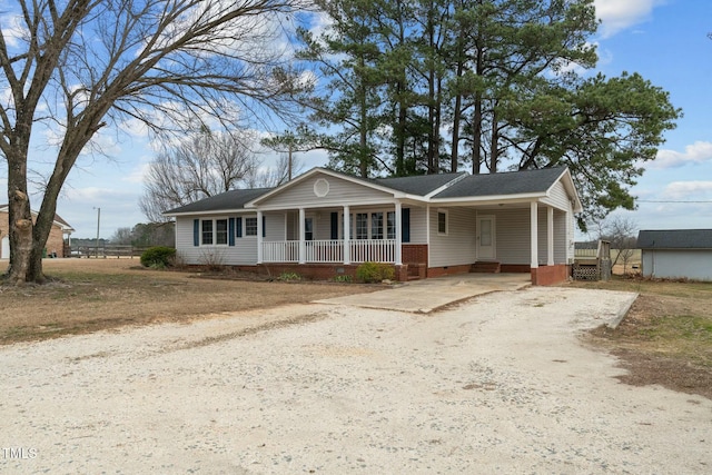 view of front of house with a carport and covered porch