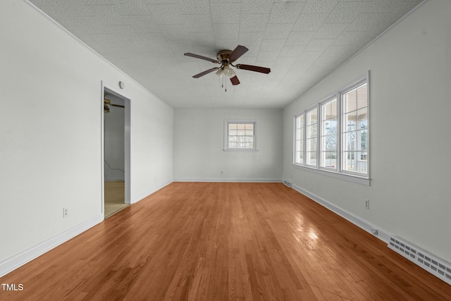 spare room featuring crown molding, ceiling fan, and hardwood / wood-style floors