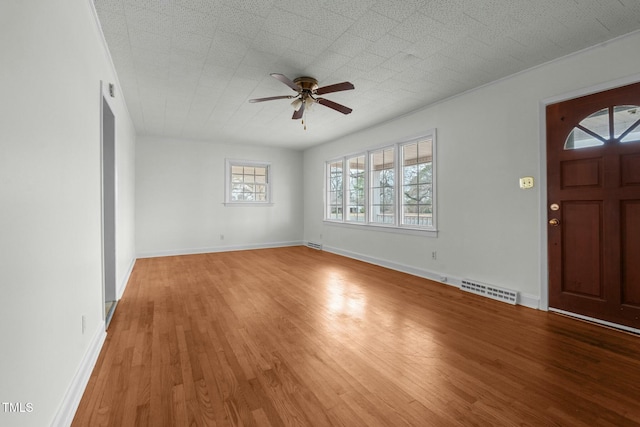 foyer entrance featuring light hardwood / wood-style floors and ceiling fan