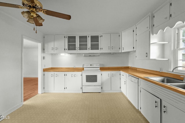 kitchen featuring ceiling fan, sink, white cabinets, and white appliances