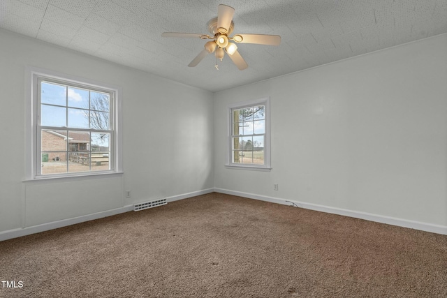 carpeted empty room with ceiling fan