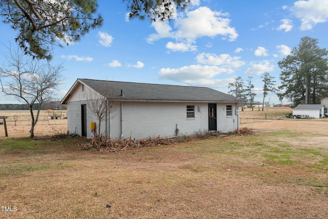 rear view of house with a lawn