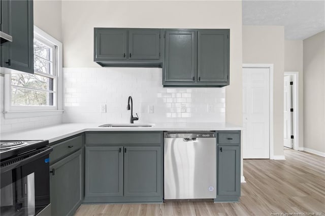 kitchen with gray cabinets, dishwasher, sink, and light wood-type flooring