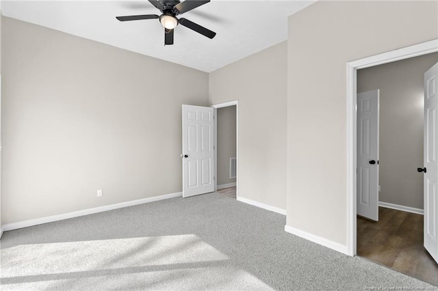 unfurnished bedroom featuring ceiling fan and carpet