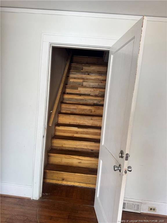 stairs with hardwood / wood-style flooring