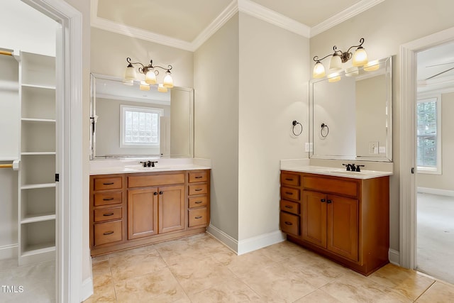 bathroom featuring vanity, plenty of natural light, and ornamental molding