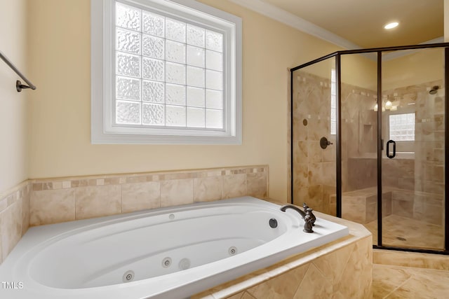 bathroom featuring independent shower and bath and ornamental molding