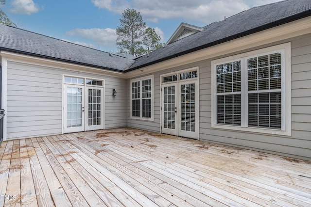 wooden deck featuring french doors