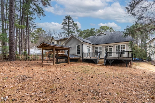 back of house featuring a wooden deck