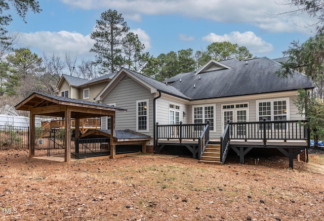 back of property with a deck