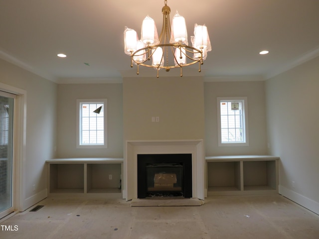 unfurnished living room with crown molding, a chandelier, and a wealth of natural light