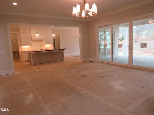 unfurnished living room featuring crown molding and a notable chandelier