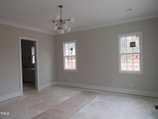 empty room featuring a notable chandelier, ornamental molding, visible vents, and baseboards