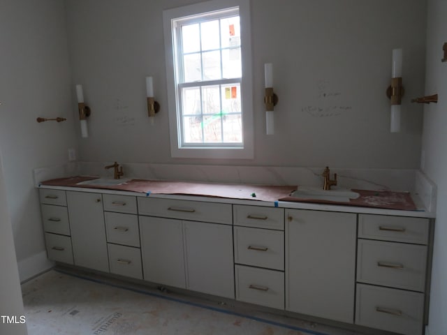 bathroom featuring dual sinks