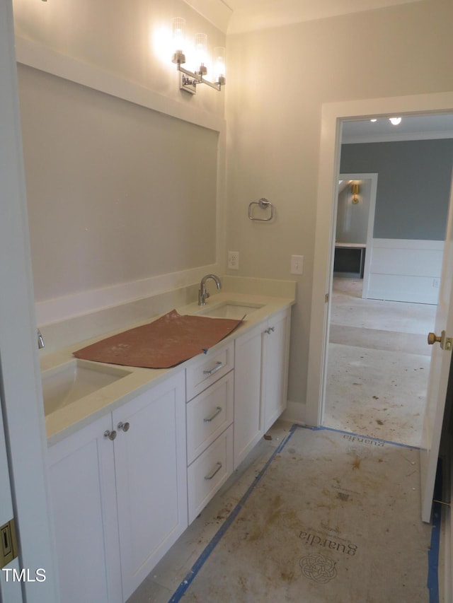 full bathroom with double vanity and a sink