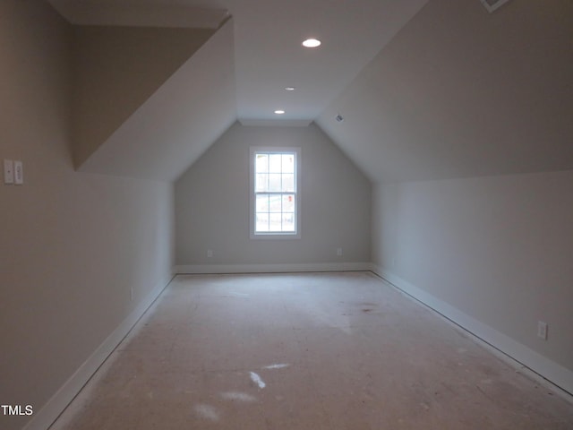 additional living space featuring vaulted ceiling