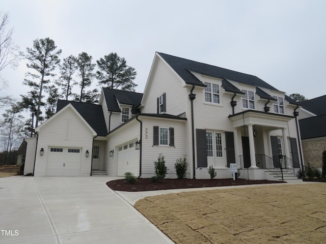 view of home's exterior with concrete driveway and a garage